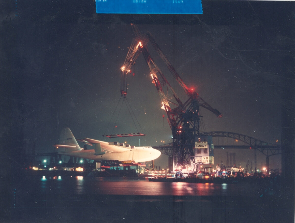 Floating crane “Herman the German” lifts the Spruce Goose as part of its move into its dome next to the Queen Mary in 1982